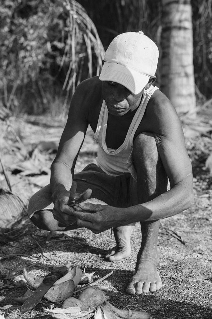 Kenya - Mombasa, getting a fresh coconut from a local farmer